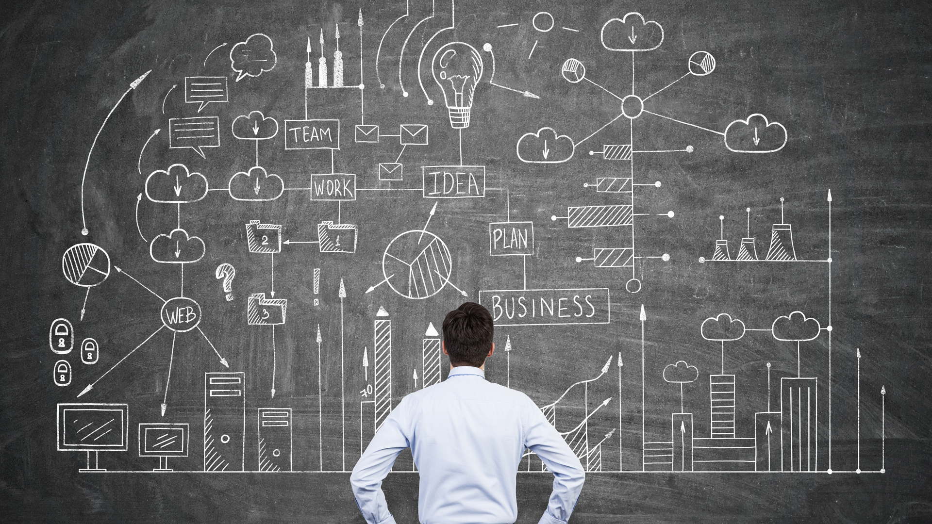 Man solving logistics on chalkboard